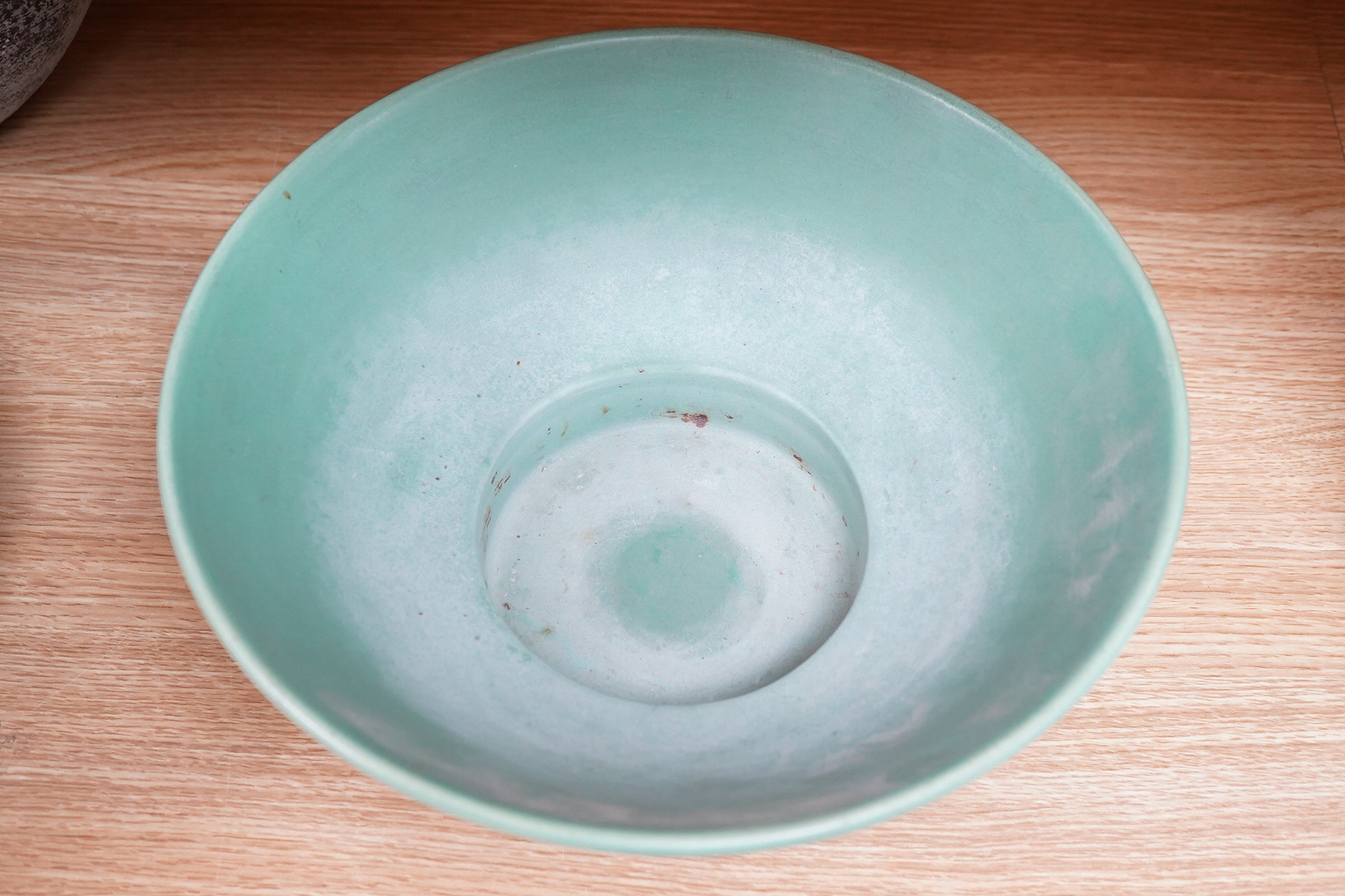 Keith Murray for Wedgwood green glazed footed bowl, 28cm in diameter